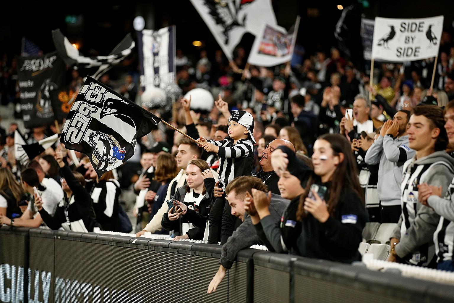 Collingwood fans seen at a match at the Melbourne Cricket Ground in March, after the easing of Covid-19 restrictions on the capacity of stadiums. Government officials have warned that events could face fresh restrictions.