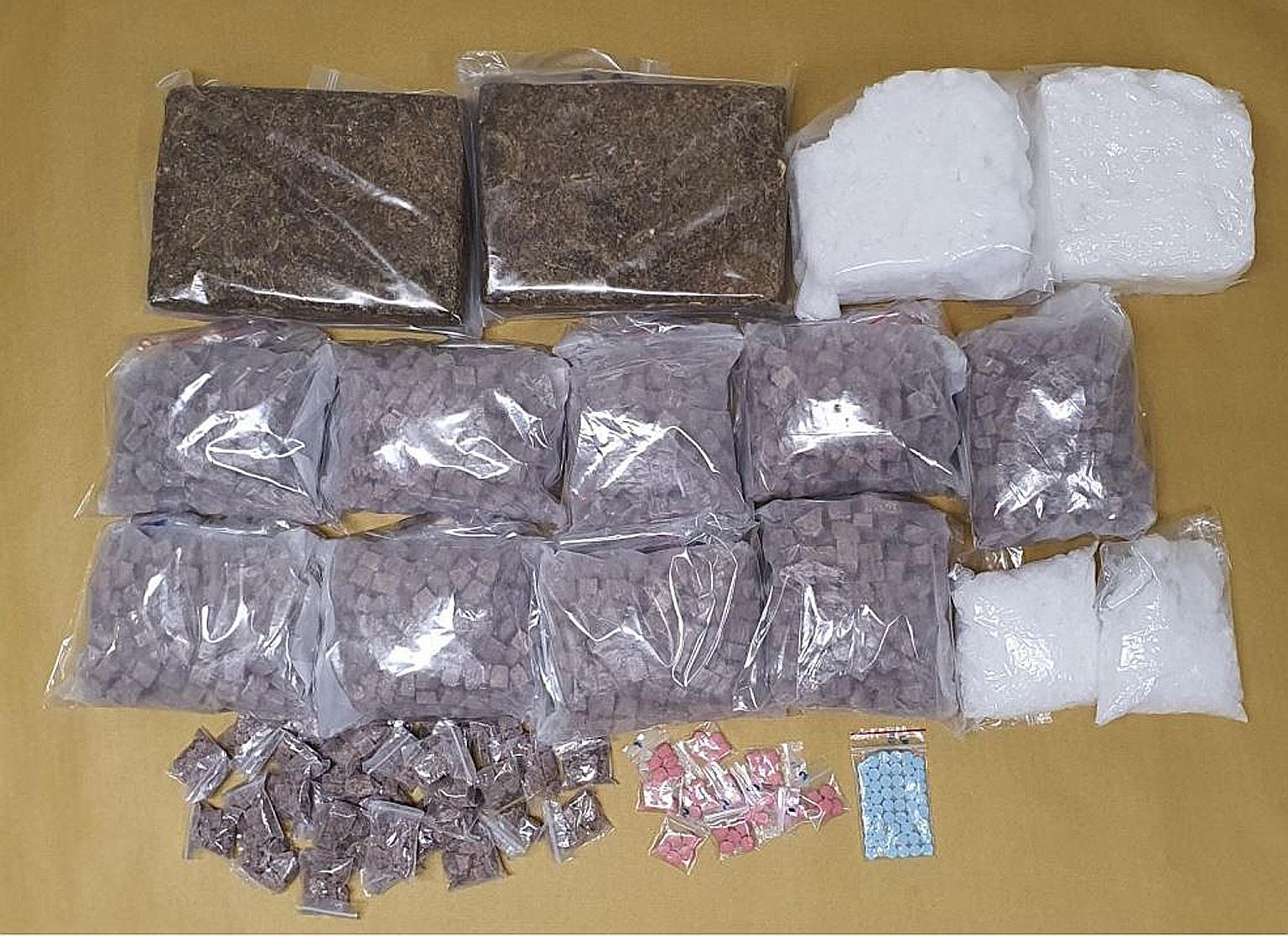 Over 10kg of drugs worth close to $944,000 were seized during a raid on Tuesday. This comprised 5.6kg of heroin, 2.5kg of Ice, 2.5kg of cannabis, 192 Ecstasy tablets, seven Erimin-5 tablets and 703 nitrazepam tablets. PHOTO: CENTRAL NARCOTICS BUREAU