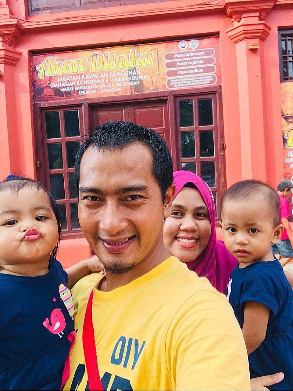 Mr Faisal Abidi with his wife, Ms Natrah Amalina, and their twin daughters, Aisha Maryam (far left) and Airis Mikhayla, in Melaka in 2019. The girls are now four years old, and the couple also have a two-year-old son.
