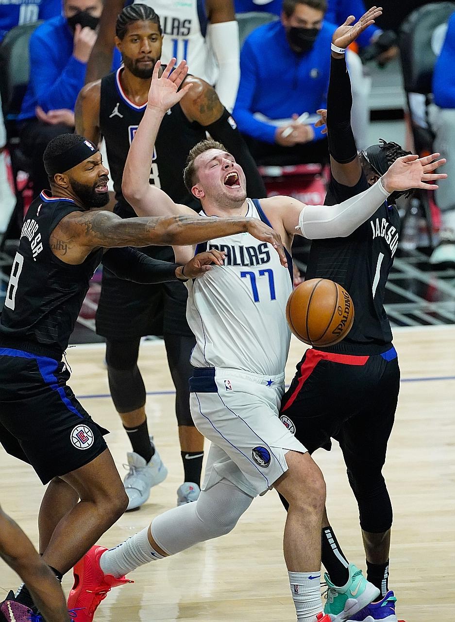 Mavericks guard Luka Doncic being fouled by Clippers forward Marcus Morris Sr. The Slovenian is once again a thorn in the Clippers' side, having starred against them in this and last season's play-offs, including a buzzer beater to win Game 4 last ye