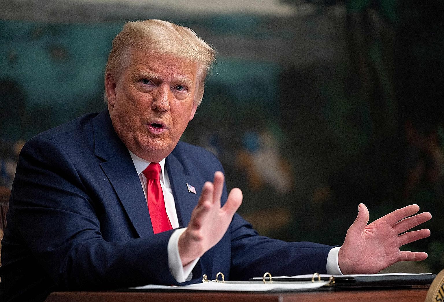 Former US president Donald Trump, seen here in a 2020 photo, could possibly become the first former US president to face criminal charges.