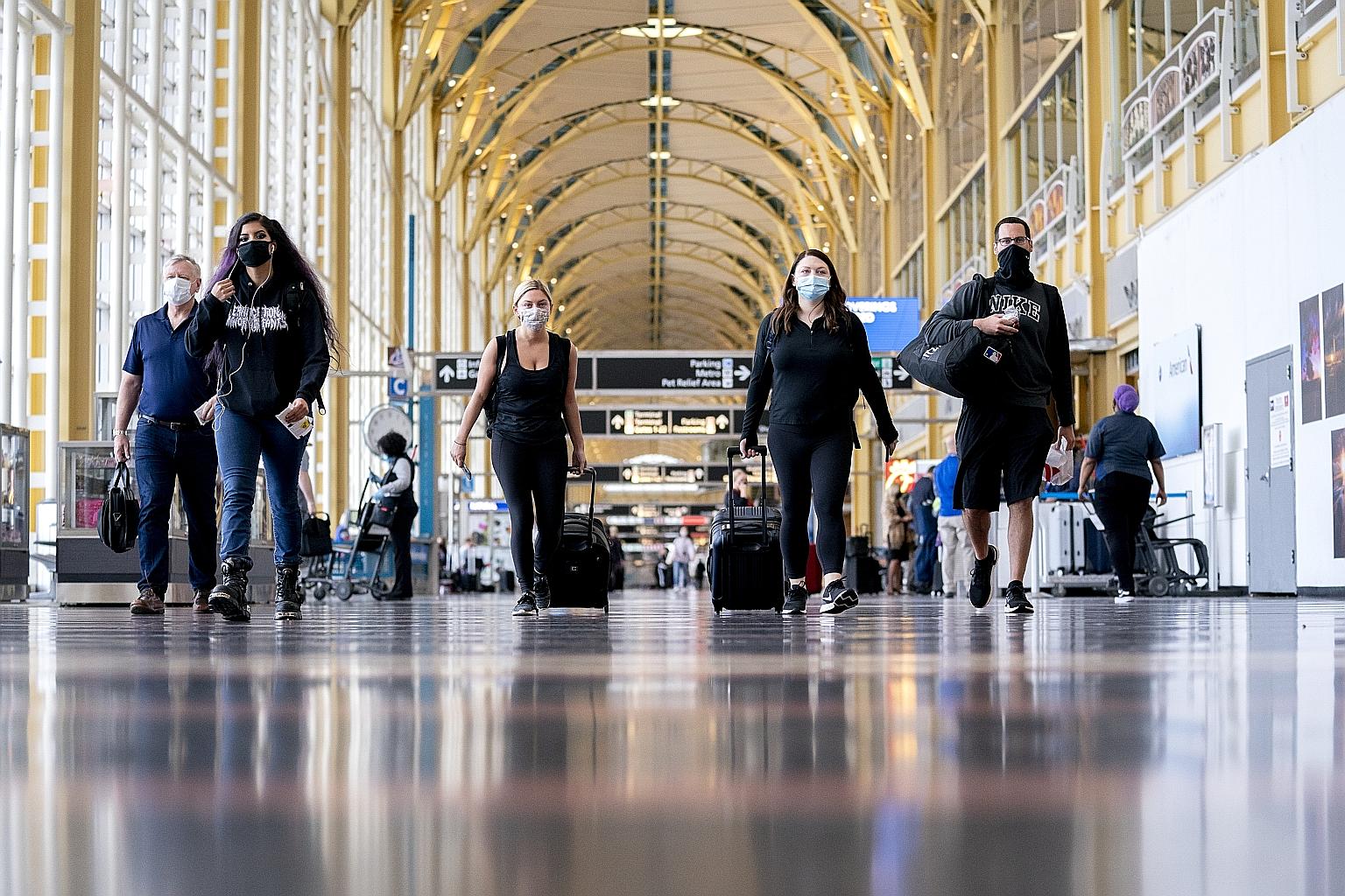 Travellers at Ronald Reagan Washington National Airport in Arlington, Virginia, on Tuesday. The International Air Transport Association believes there will be an instant surge in bookings when borders reopen, as the economy is strong and can fuel gro