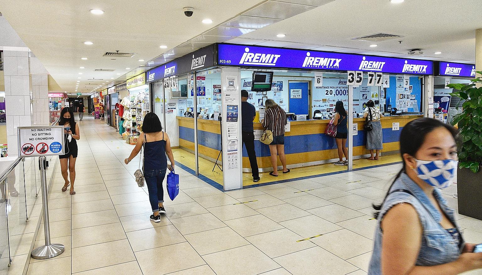 Some employers are worried that their domestic workers may socialise in groups and crowd in areas like Lucky Plaza (left) on their rest days, said Ms K. Jayaprema, president of the Association of Employment Agencies Singapore, who added that there sh