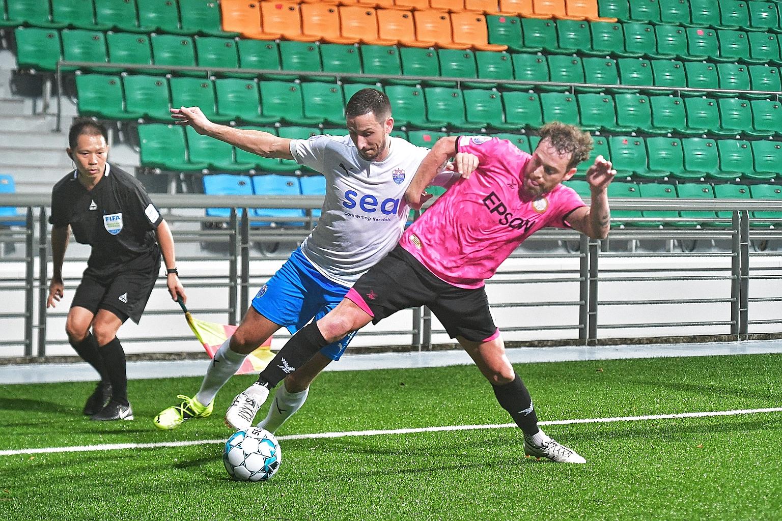 Lion City Sailors' Stipe Plazibat (left) and Geylang International's Barry Maguire going for the ball in a Singapore Premier League match between the two sides at the Jalan Besar Stadium earlier this month. The two teams will now have to play their A