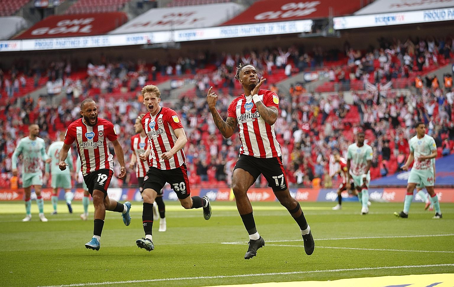 A 10th-minute penalty from Ivan Toney (right), followed nine minutes later by Emiliano Marcondes' cool finish from a swift counter-attack sent Brentford on their way to a 2-0 win in yesterday's Championship play-off final and a place in next season's