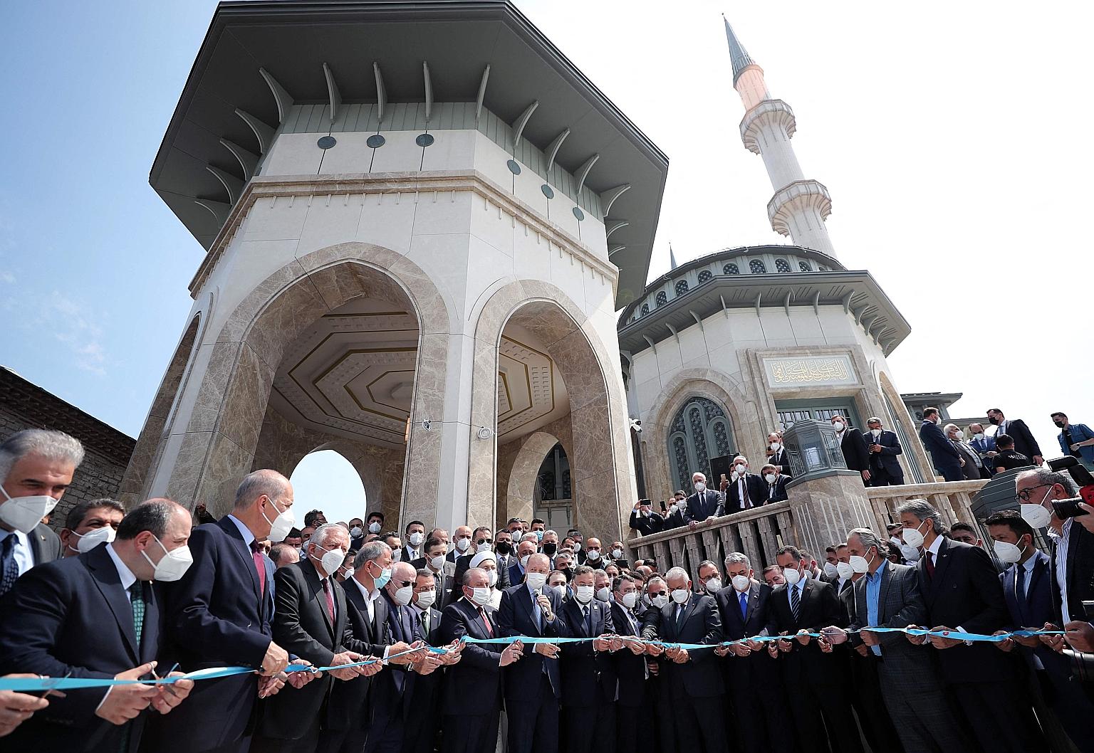 Turkish President Recep Tayyip Erdogan (centre, holding microphone) inaugurating the new Taksim Mosque on Taksim Square in Istanbul on Friday. Construction of the mosque began in 2017 in a project championed by Mr Erdogan and his Islamist-rooted AK P