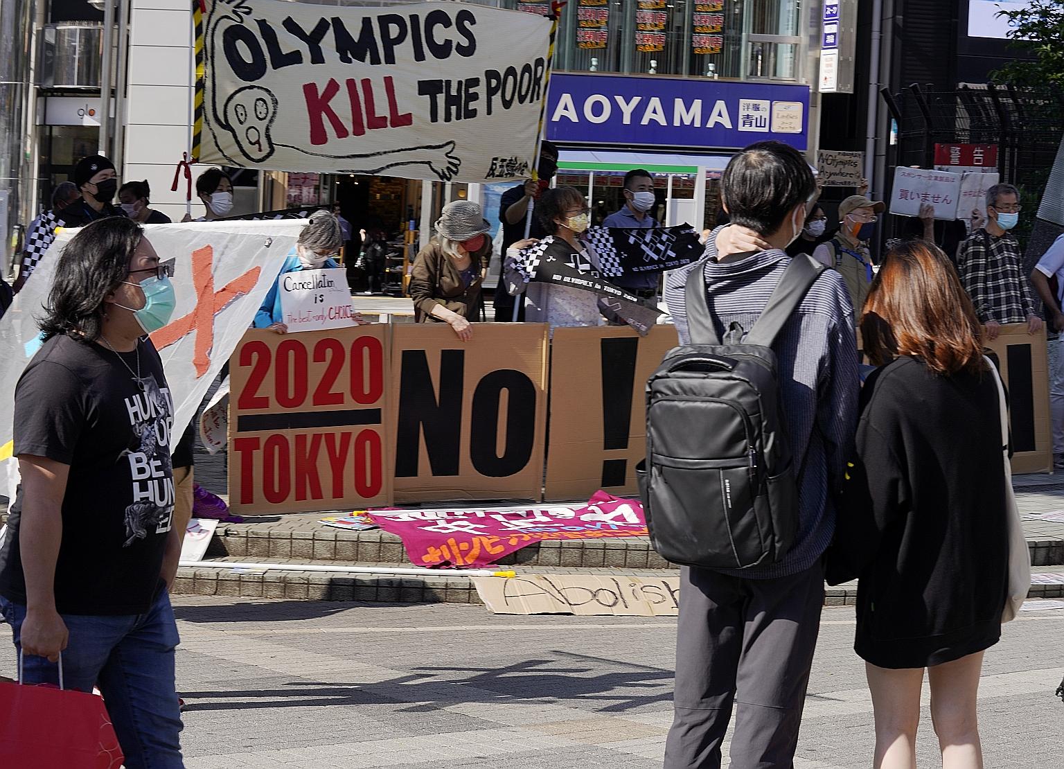 Residents protesting against the Olympic Games in Shinjuku, in Tokyo. The mood is overwhelmingly negative among media outlets and businesses, as well as the Japanese public. PHOTO: EPA-EFE