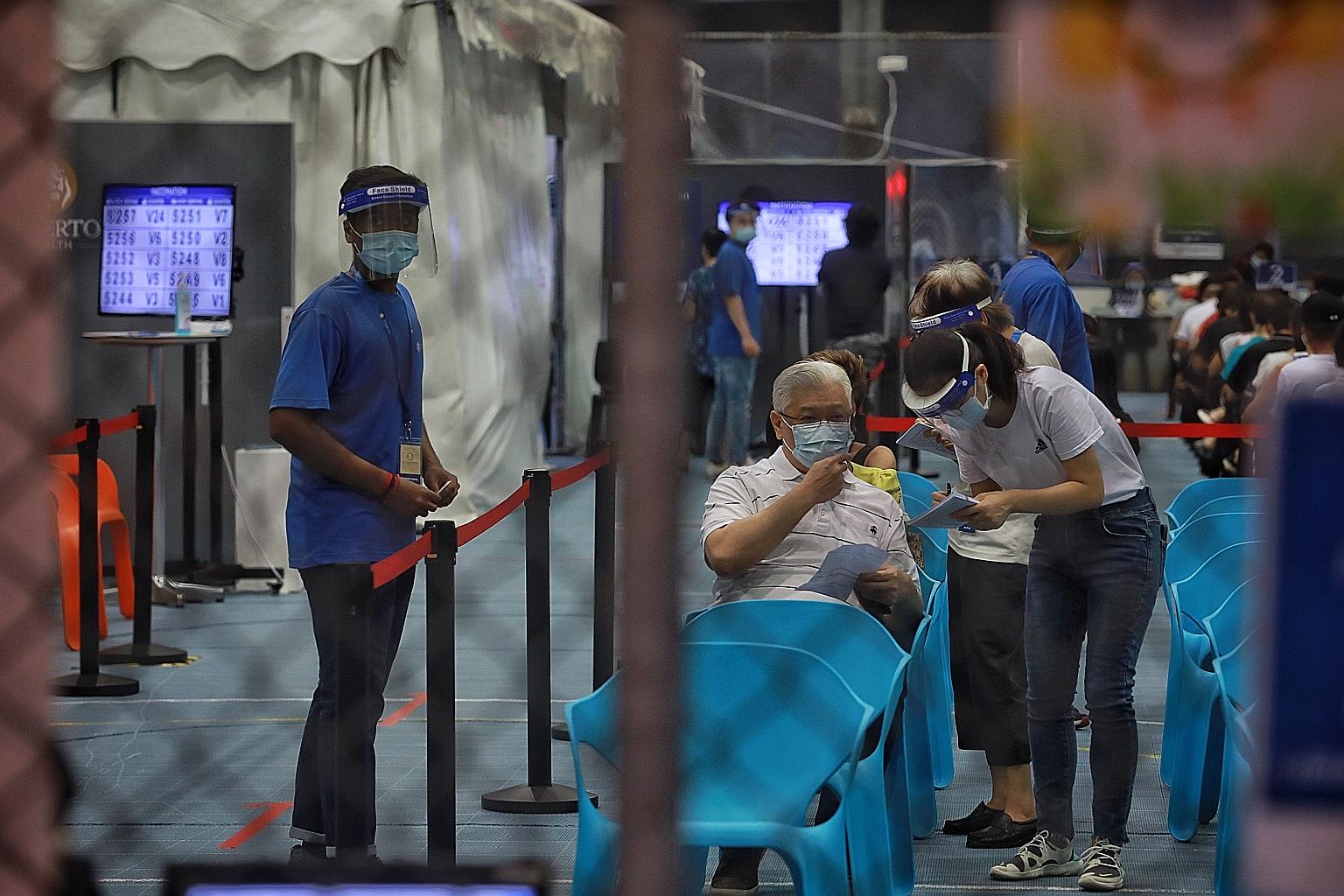 An elderly man at a Covid-19 vaccination centre at Arena@Our Tampines Hub yesterday. Seniors in Singapore who are above 60 years old will not need to register or book an appointment in advance to get their Covid-19 jabs at any vaccination centre.