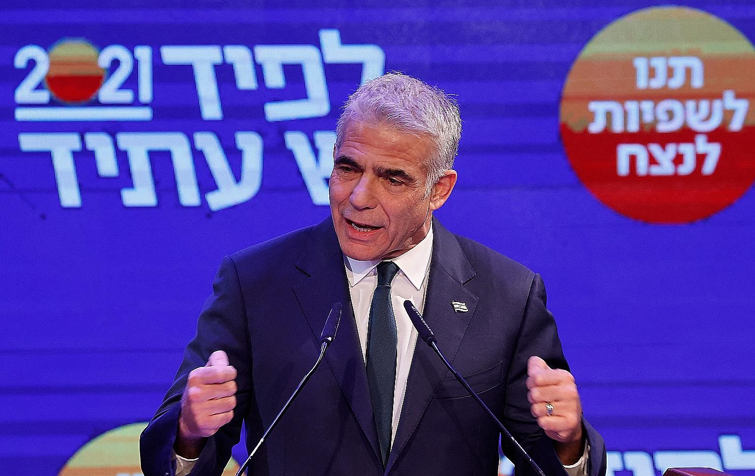 After exiting the Blue and White coalition, Mr Yair Lapid took his seat in Parliament as leader of the opposition. PHOTO: AGENCE FRANCE-PRESSE