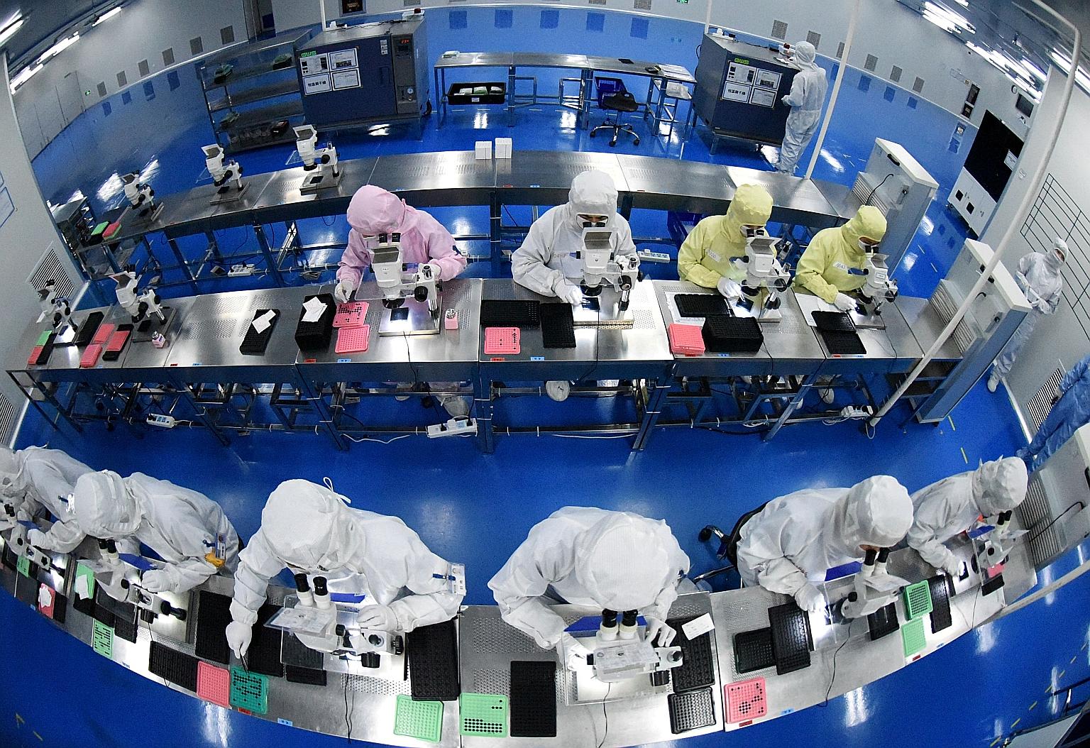 A factory producing camera lenses for mobile phones in China's Jiangsu province in 2019. While the Chinese economy has largely shaken off the gloom from the pandemic, analysts expect the brisk expansion to moderate later this year.