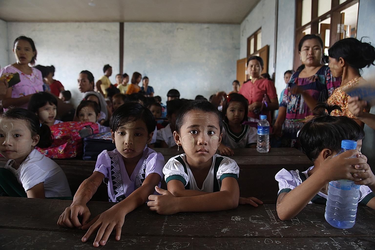 Primary school children on the first day of the new school year on Tuesday, in Sittwe in Myanmar's Rakhine state. A Myanmar Teachers' Federation official said fewer students had turned out than had been enrolled in many schools because parents were c
