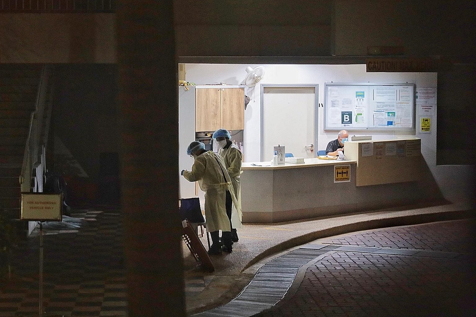 People in personal protective gear at MINDSville@Napiri last night. A Covid-19 cluster of 27 cases has surfaced at the home for people with intellectual and developmental disabilities, with 26 new cases uncovered yesterday after a resident tested pos