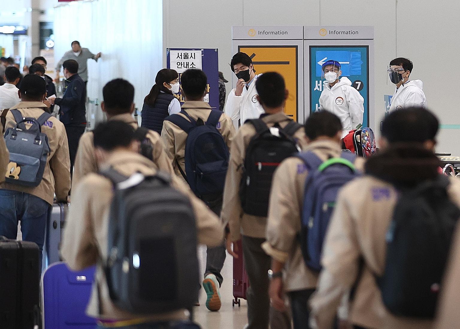 Overseas arrivals undergoing quarantine procedures at South Korea's Incheon International Airport on May 21. Industry sources have named Singapore among potential partners for an air travel bubble with South Korea.