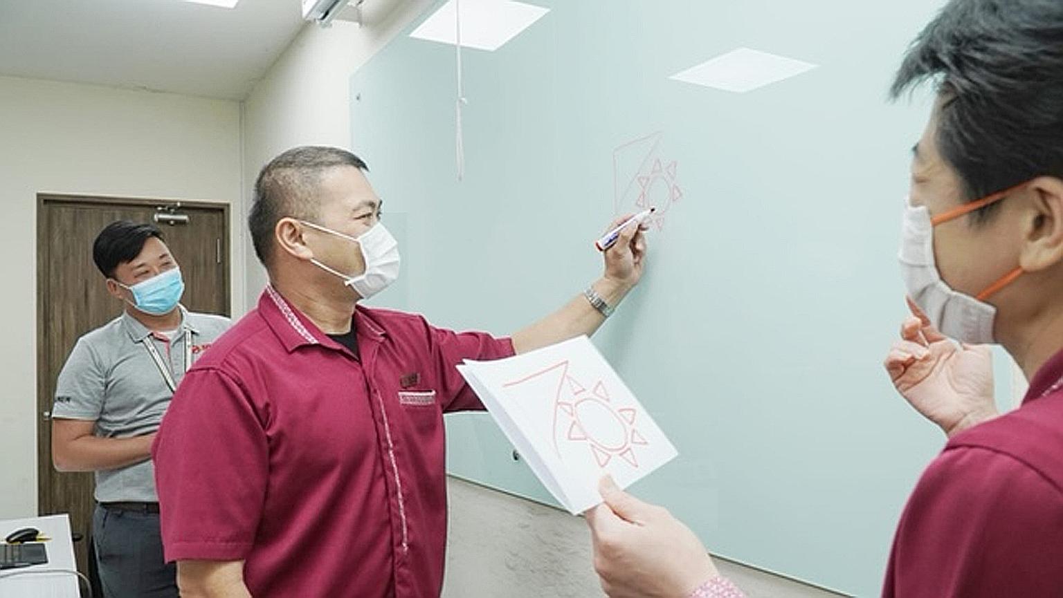 Front-line staff of SMRT Buses undergoing training to better communicate with and help commuters with special needs. The public transport operator has partnered the Movement for the Intellectually Disabled of Singapore and charity SPD to conduct trai