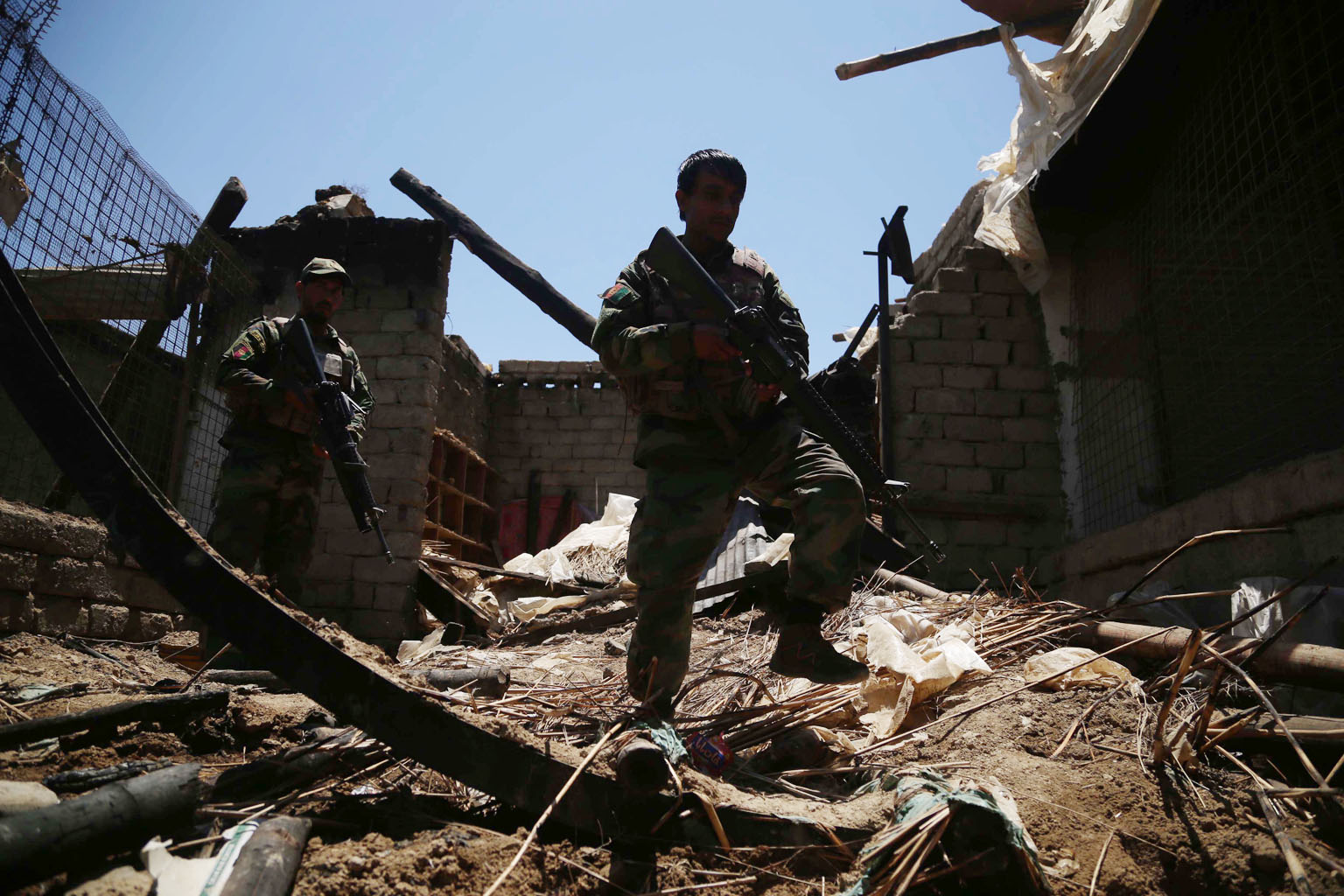 Afghan security officials patrolling a village in Nangarhar province after it was cleared of Taleban militants late last month. The US and its Nato partners are set to complete their withdrawal from the country by Sept 1.