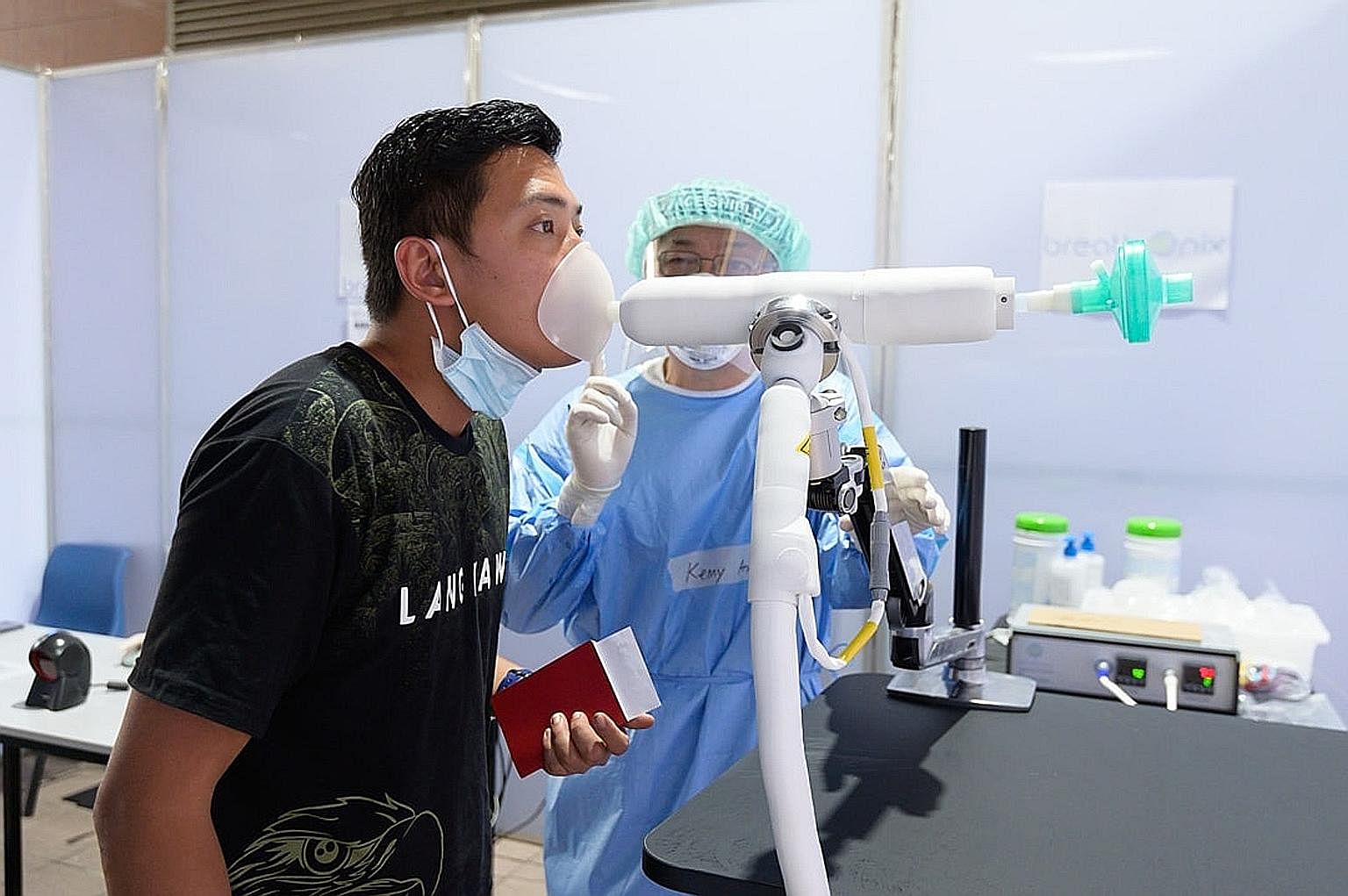 A trial for a new breathalyser test that can identify Covid-19 infections is taking place at Tuas Checkpoint. Finance Minister Lawrence Wong, in a post on Facebook yesterday, said he and Trade and Industry Minister Gan Kim Yong visited the checkpoint