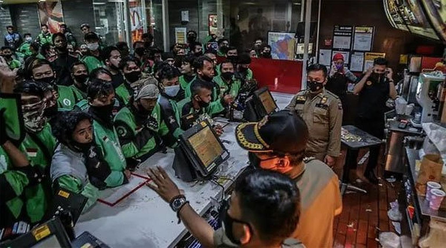 At least 13 McDonald's outlets were deluged with online food delivery drivers picking up meal sets named after the boy band BTS. PHOTO: INTERNET