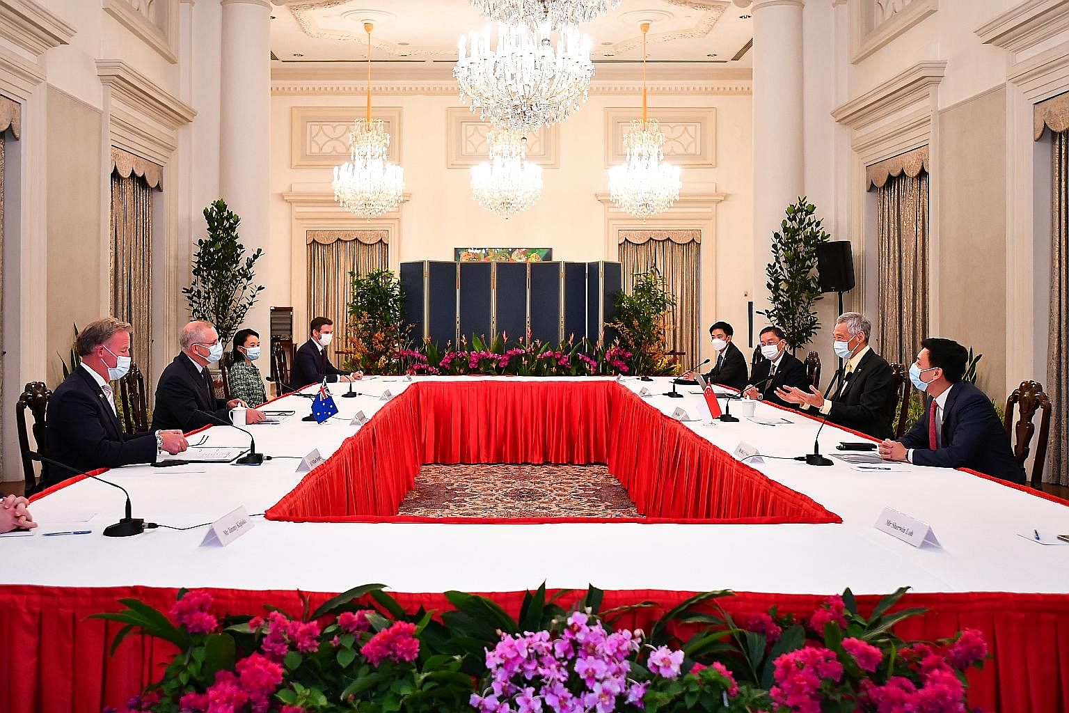 Prime Minister Lee Hsien Loong speaking with Australian Prime Minister Scott Morrison (second from left) at the sixth Australia-Singapore Annual Leaders' Meeting at the Istana yesterday. With them were (from left) Mr William Hodgman, Australia's High