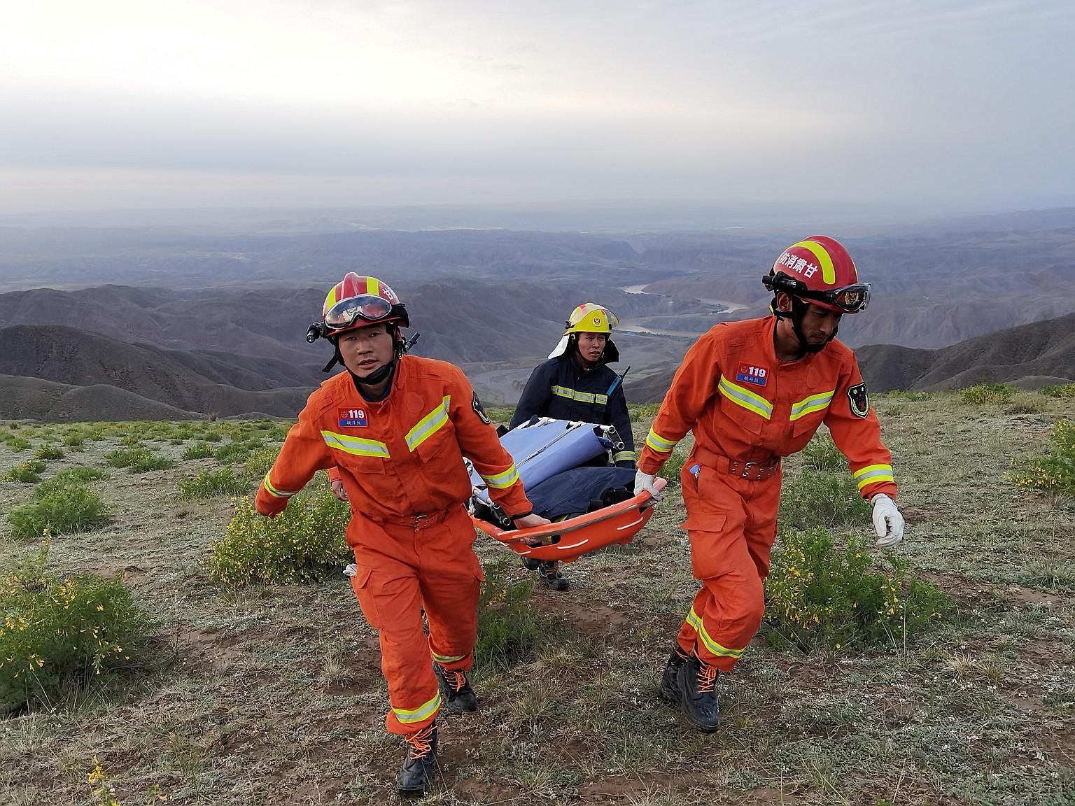 Rescuers at the site of the 100km marathon, during which extreme cold weather killed 21 runners, in China's Gansu province on May 22.
