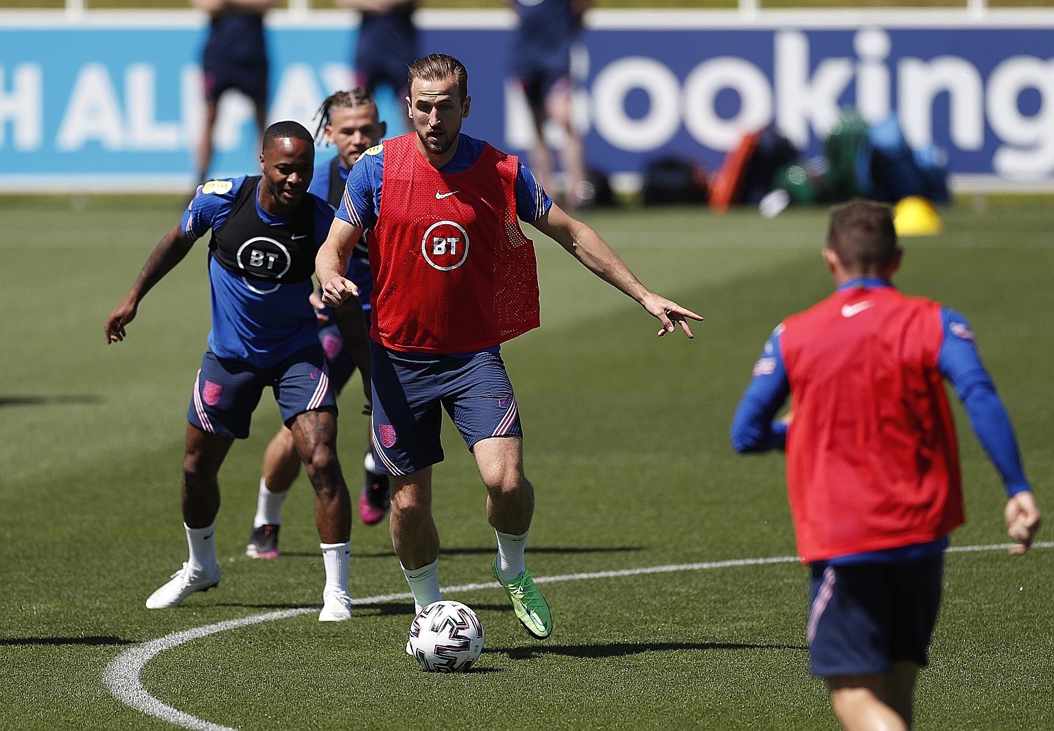 Harry Kane and Raheem Sterling at training last Wednesday. While the England captain, who has 34 goals in 54 games, holds the key to success, coach Gareth Southgate will not hesitate to use squad members if needed.