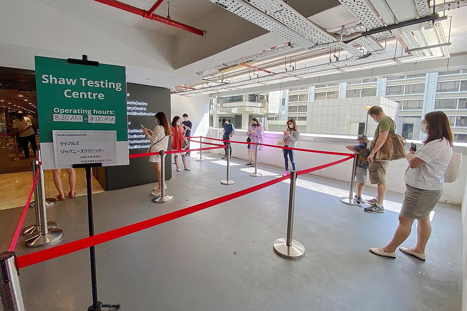 Part of the queue for getting swabbed at Raffles Medical in Shaw Centre yesterday. Most of the people say they are getting tested just to be safe. Others say it's for the safety of the people around them.