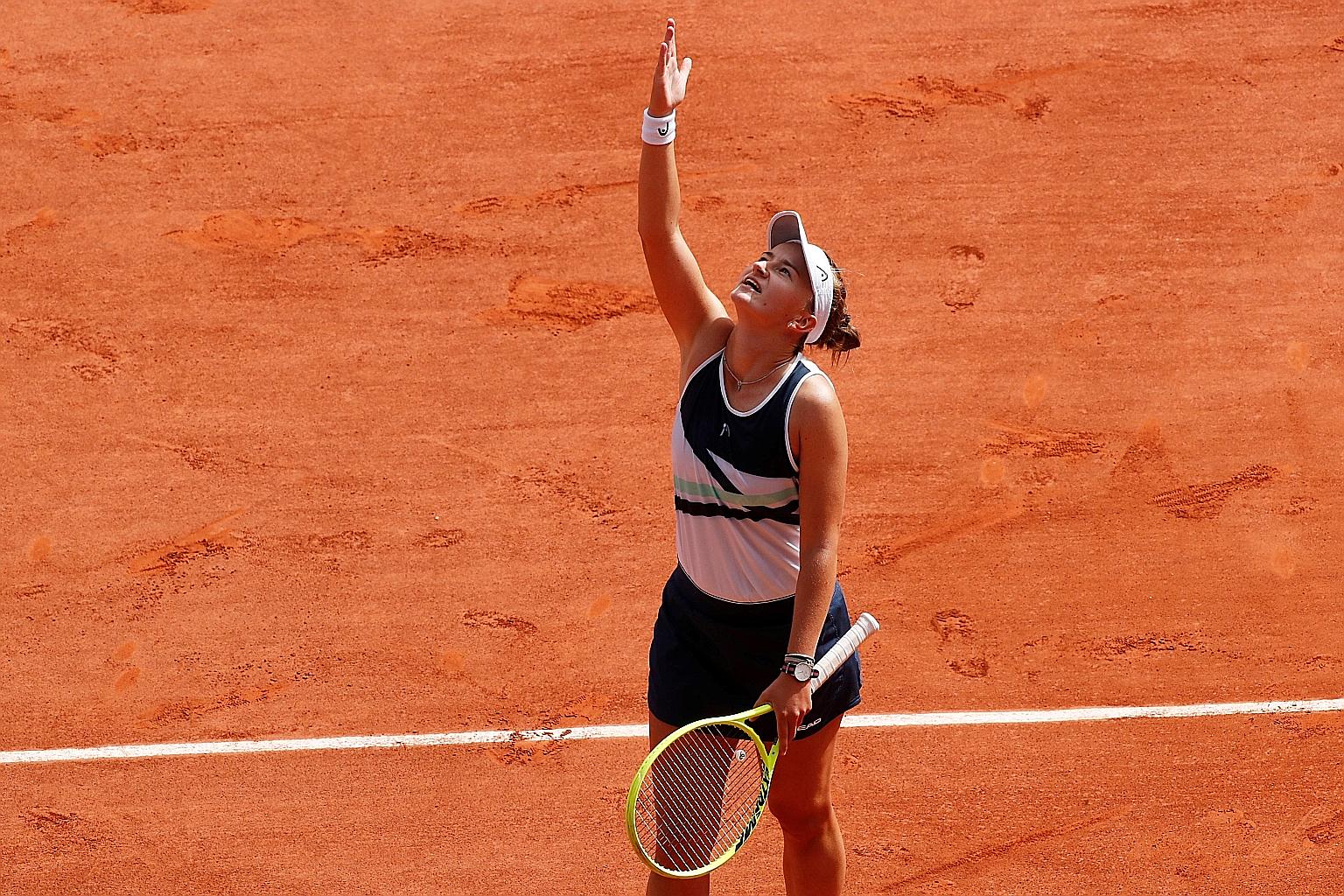 Czech Republic's Barbora Krejcikova pointing to the sky as she acknowledges her mentor and role model, the former Czech champion Jana Novotna, who died of cancer at 49 in 2017, following her French Open triumph over Anastasia Pavlyuchenkova.