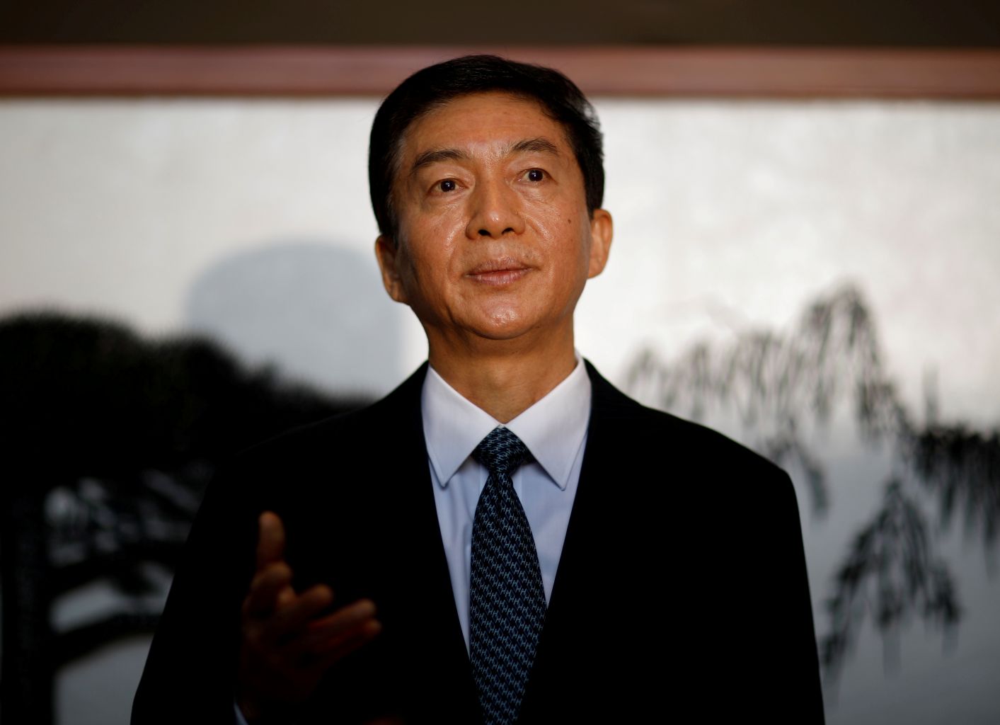 BEIJING'S LIAISON OFFICE DIRECTOR LUO HUINING (above),