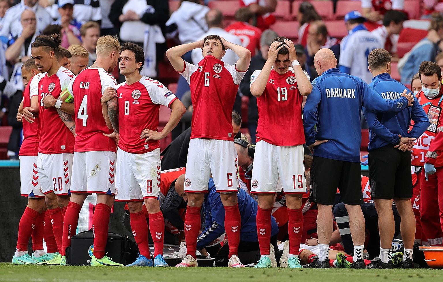 Denmark's players were distraught while Christian Eriksen received medical treatment during Saturday's Euro 2020 match against Finland.