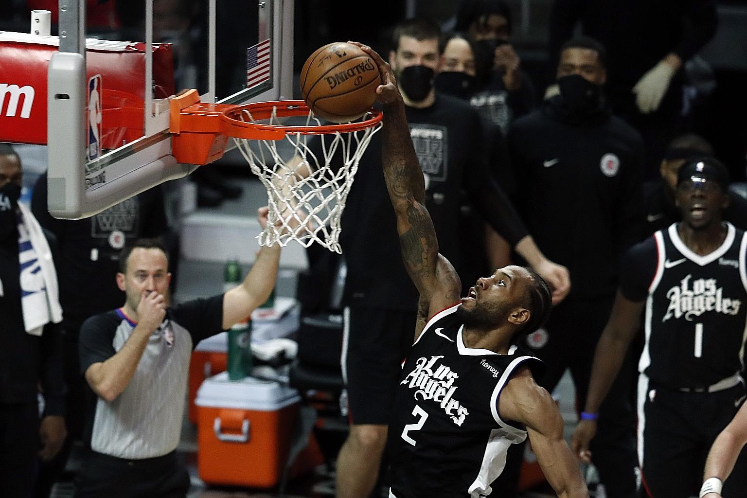 Kawhi Leonard scoring an unchallenged basket during the Los Angeles Clippers' 132-106 hammering of the Utah Jazz at the Staples Centre on Saturday. His 34 points helped the Clippers cut the deficit to 2-1 in their NBA second-round play-off series. PH