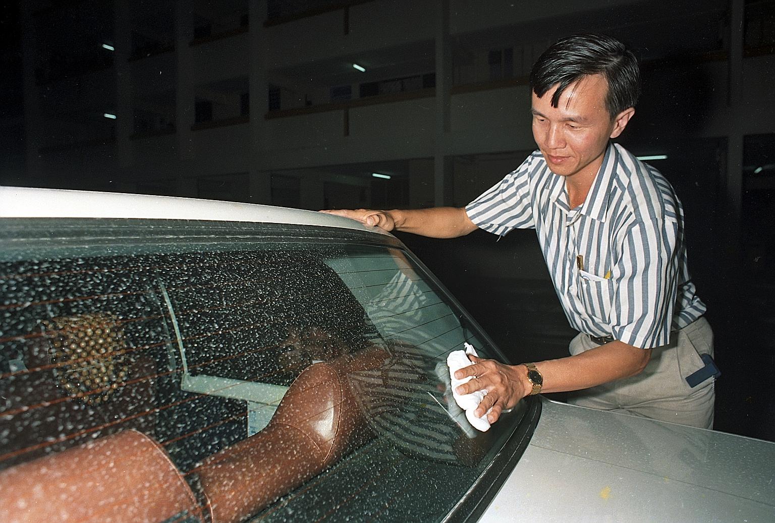 Car owners in Singapore wiping down their vehicles on June 17 and 18, 1991, after ash from the eruption of Mount Pinatubo in the Philippines was blown more than 2,400km to the Republic by high winds.