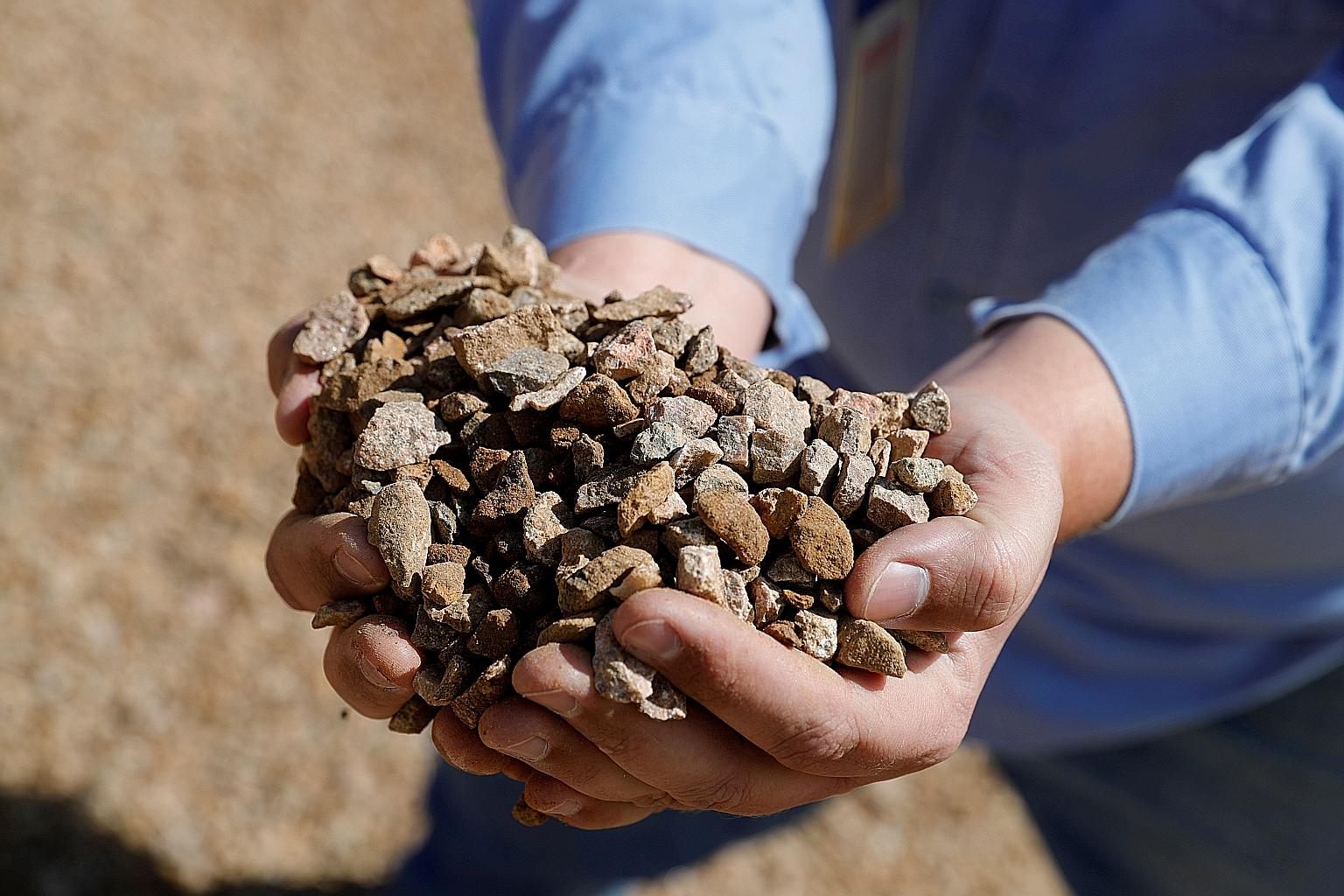 Crushed ore at MP Materials' rare earth mine in California's Mountain Pass. The company aims to make it a symbol of the United States' industrial rebirth, saying the concentration of rare earths at its site is one of the world's largest and highest-g