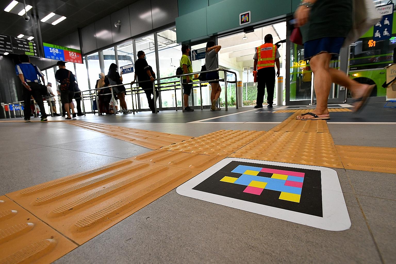 On trial at Woodlands Integrated Transport Hub is the NaviLens app, which provides audio assistance to commuters with visual disabilities when they point a phone camera in the general direction of a coloured tag.