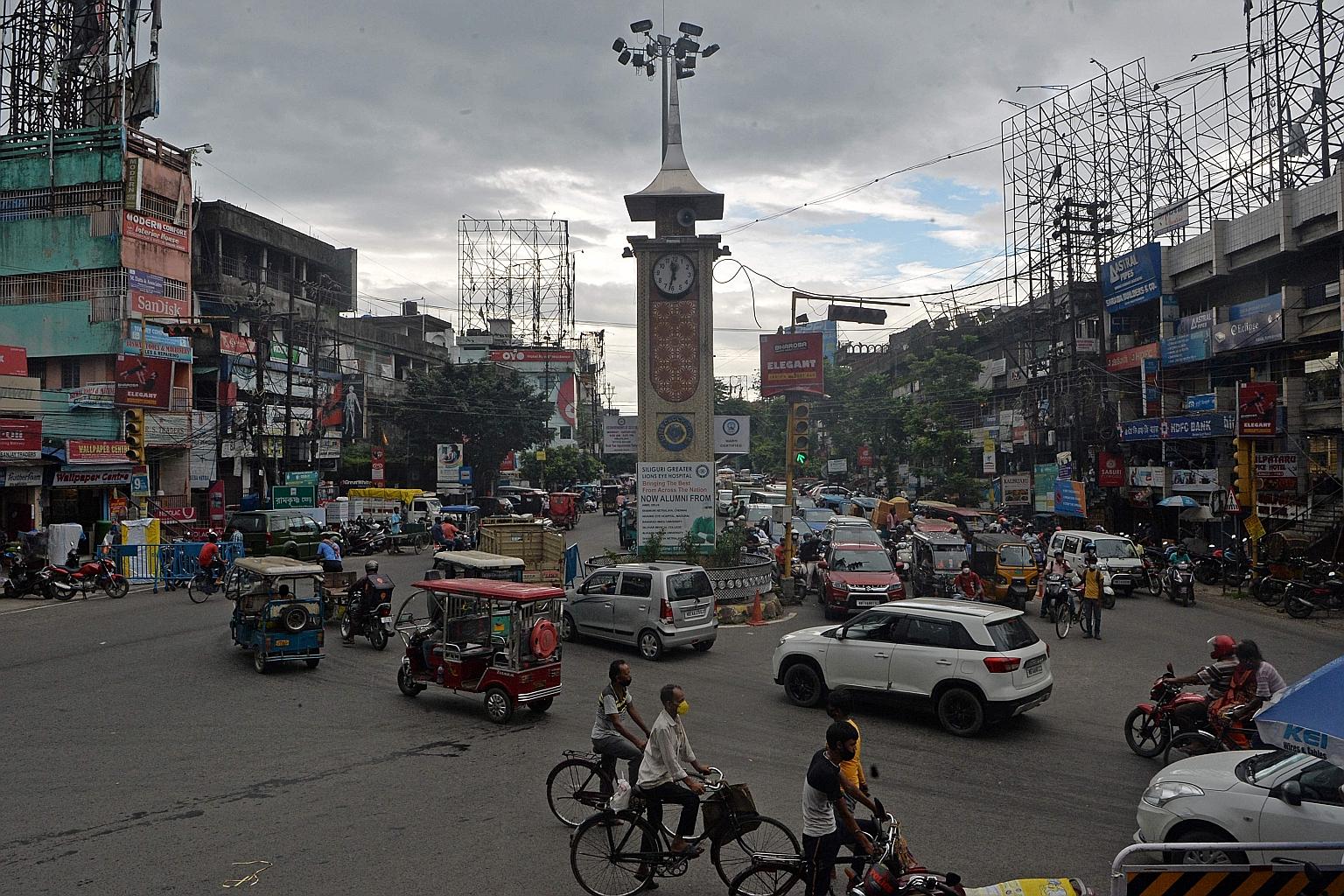 Traffic in West Bengal's Siliguri yesterday, after virus measures were eased. Experts warn against a full reopening as India has fully vaccinated only about 5 per cent of its 950 million adults.