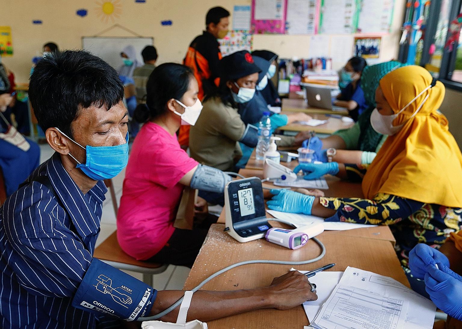 A pre-vaccination health screening centre in Jakarta. The Covid-19 testing rate in Indonesia's capital has risen to eight times what the World Health Organisation recommends, from four times in the previous week, says Jakarta Governor Anies Baswedan.