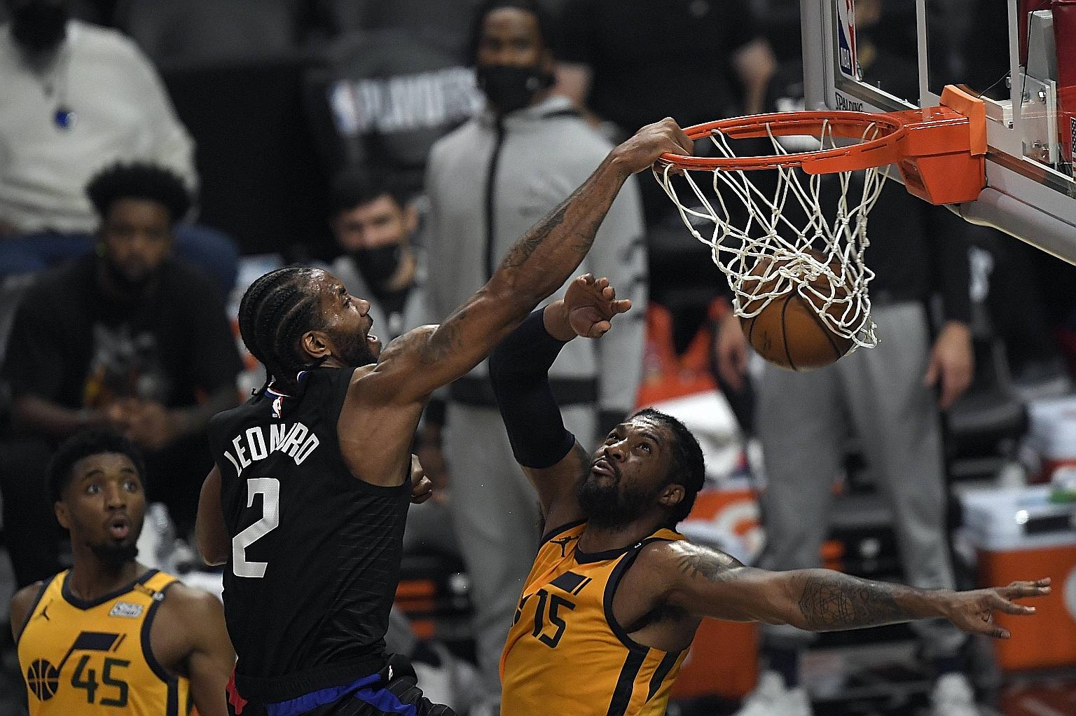 Clippers forward Kawhi Leonard dunking over Jazz's 2.06m centre Derrick Favors in his team's 118-104 win on Monday to even the Western Conference semi-final series at 2-2. The highlight following two quick dribbles and a huge leap - widely regarded a