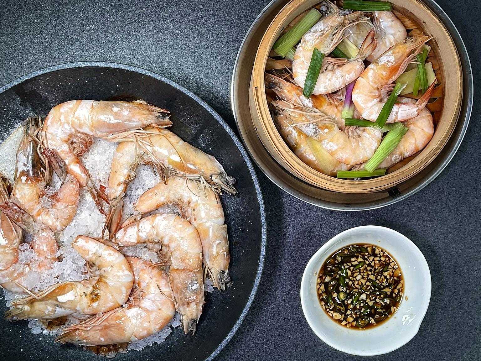 Salt-baked prawns (far left) and steamed prawns with dipping sauce.