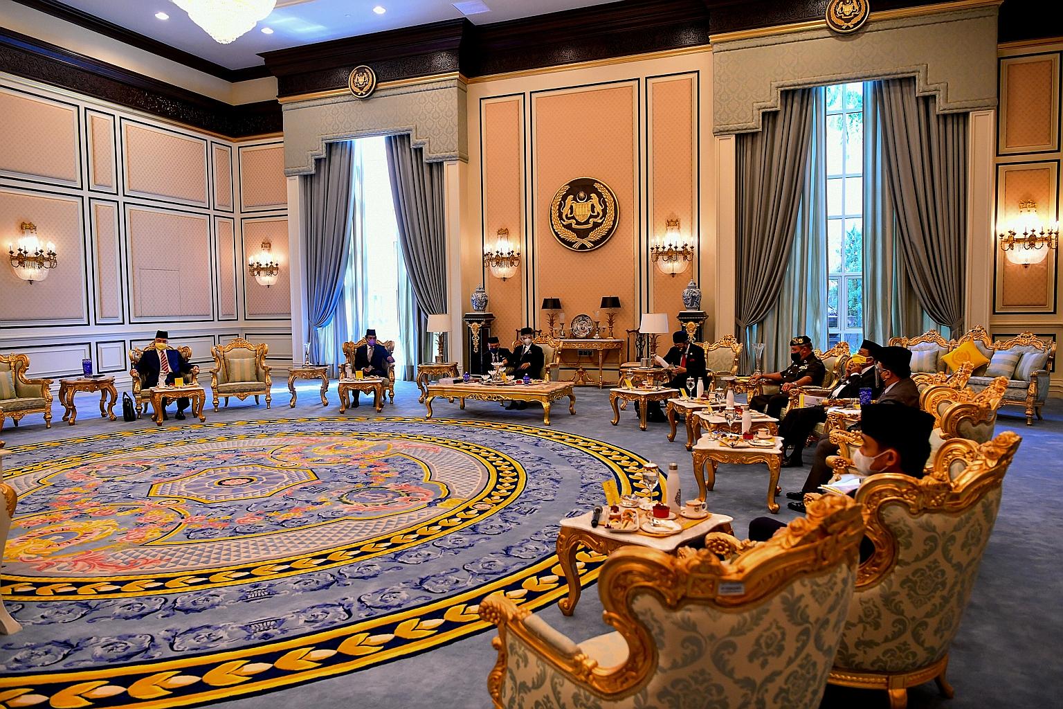 Malaysia's King, Sultan Abdullah Ahmad Shah (seated, third from left), chairing the special meeting of Malay rulers at Istana Negara in Kuala Lumpur yesterday, in a culmination of a series of audiences the King gave to 18 party chiefs and experts ove