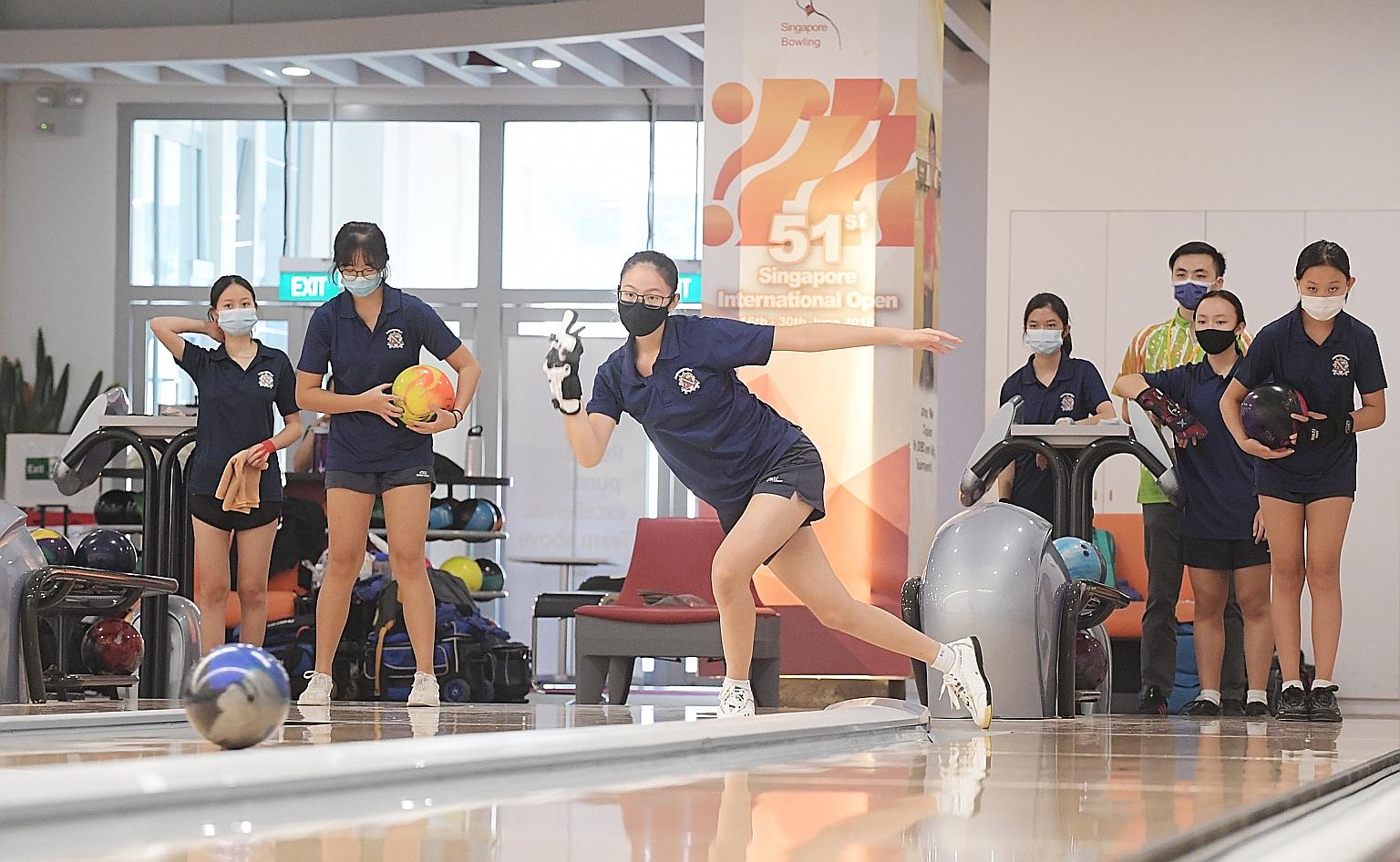 Katong Convent girls warming up during the National School Games' B Division bowling singles championship in April. The sport is one of the 12 eligible for Colours Awards as it was contested before the NSG's cancellation.