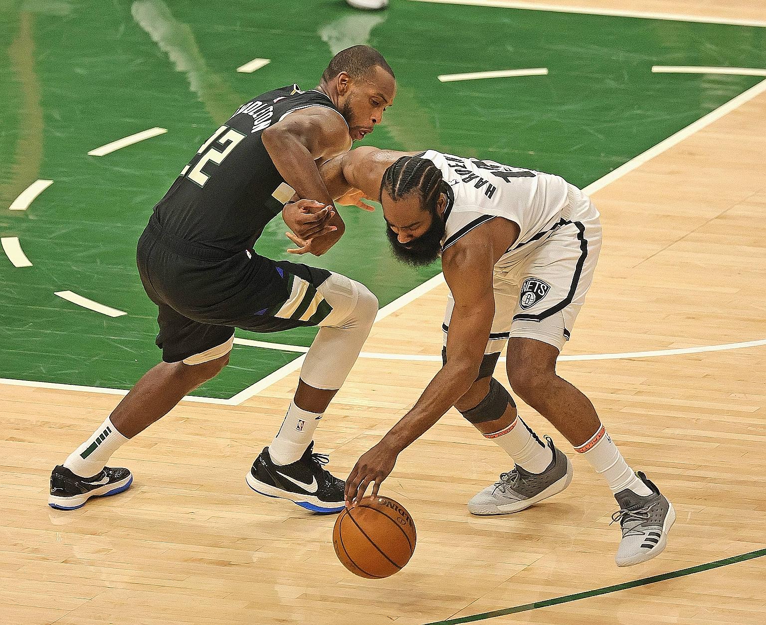 The Nets' James Harden stealing the ball from the Bucks' Khris Middleton in Game 6 of their NBA play-off series on Thursday in Milwaukee. The Bucks won 104-89, with Middleton and Giannis Antetokounmpo scoring 38 and 30 points respectively.
