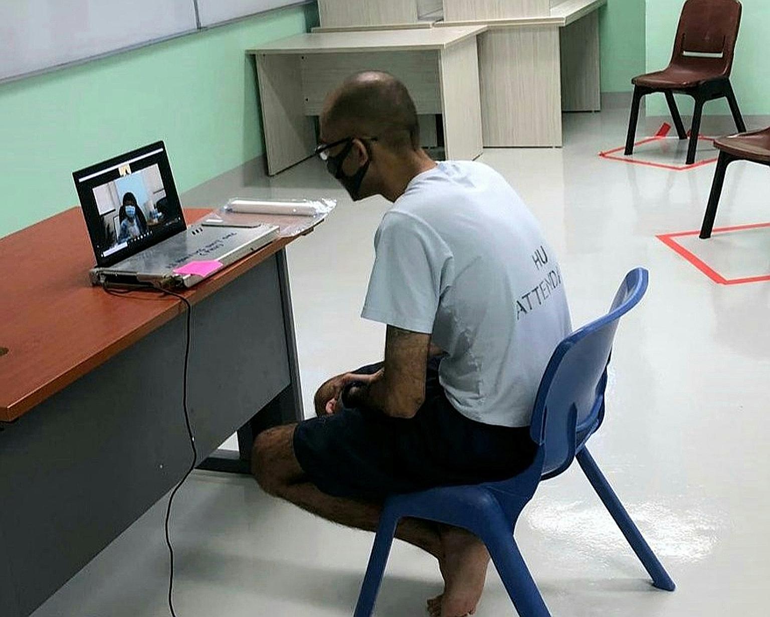 Above: Ebrahim, 40, talking to his family via Zoom in April. The visit took place over Zoom due to precautionary measures taken because of the Covid-19 pandemic. Above, left: A card Ebrahim made for his daughter Qysha.