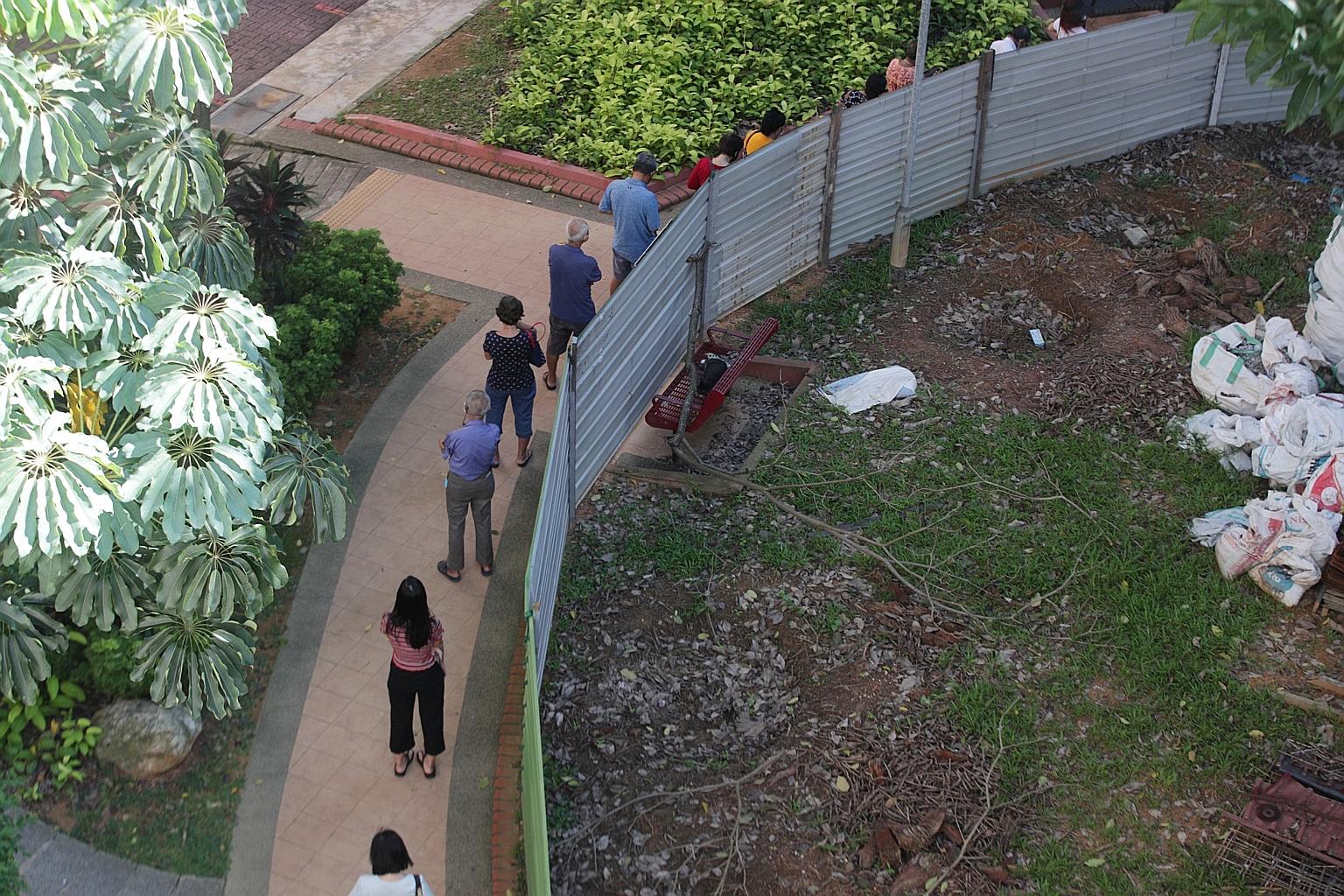 People queueing to enter the temporary Covid-19 testing area set up at Block 125A Bukit Merah View last week. The site was set up to test stallholders in Bukit Merah View for the coronavirus, but was later opened to residents of the area too.