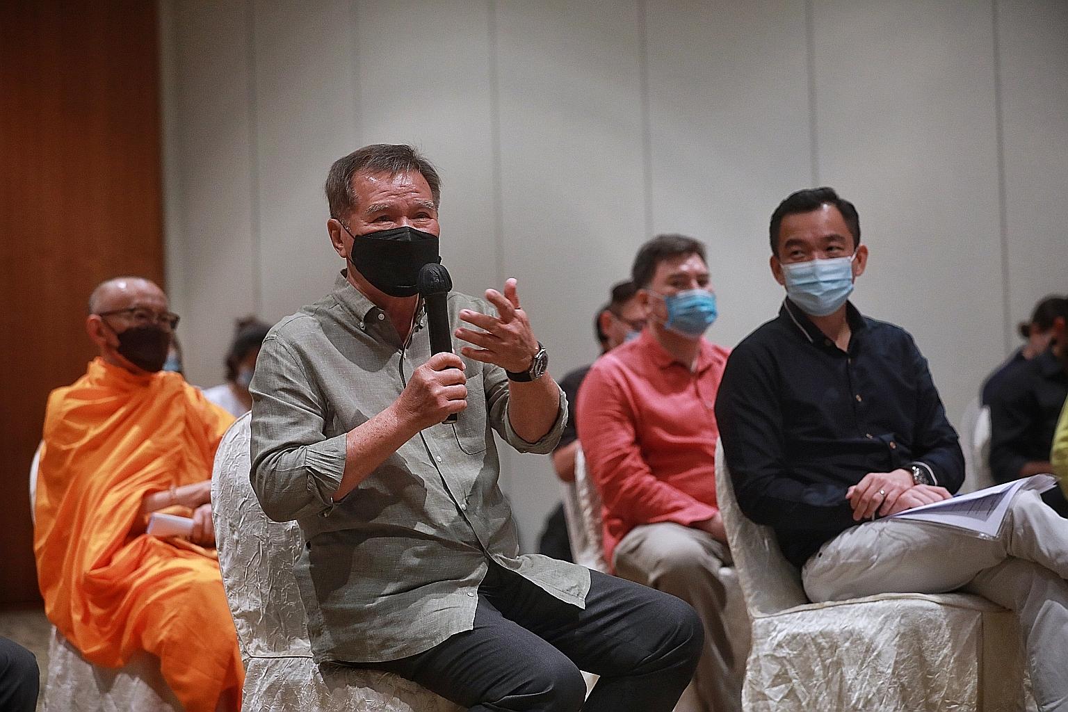 Former Speaker of Parliament Abdullah Tarmugi sharing his views yesterday at an interfaith dialogue led by four panellists from the Buddhist, Hindu, Muslim and Taoist faiths. Parliamentary Secretary for Culture, Community and Youth Eric Chua (right)