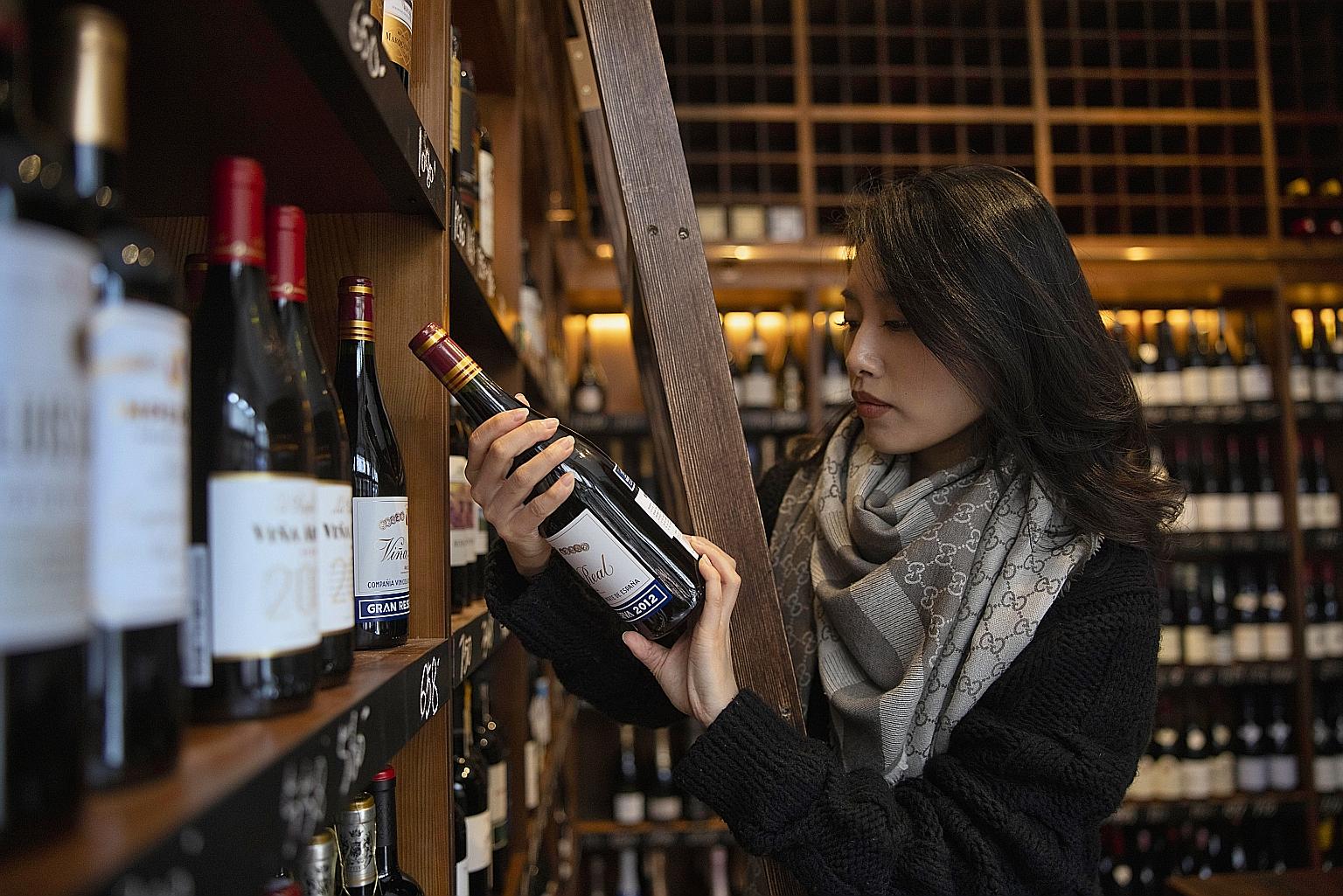 Imported wine being sold in a shop in Shanghai last year. Last November, China slapped tariffs of up to 218 per cent on Australian wines, which it said were being "dumped" in the Chinese market at subsidised prices. The crackdown virtually closed wha
