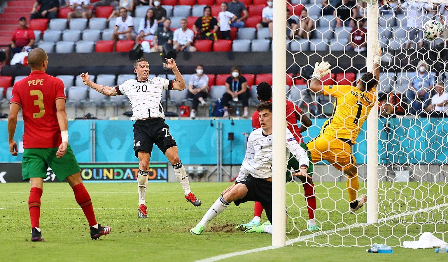 Germany's Robin Gosens scoring his team's fourth goal in the 4-2 win over Portugal on Saturday. He was the game's top performer, with two assists as well.
