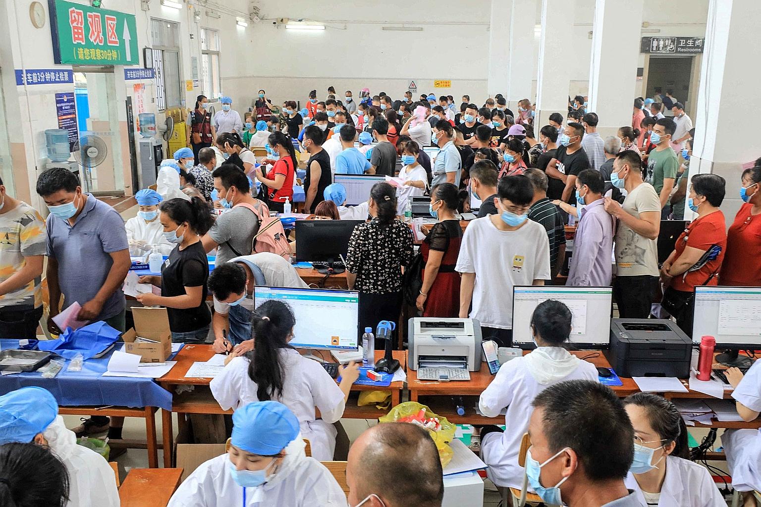People in Rongan county in China's southern Guangxi region queueing up earlier this month to receive the Sinovac Covid-19 vaccine. China aims to vaccinate 40 per cent of its population, or about 580 million people, by the end of this month.
