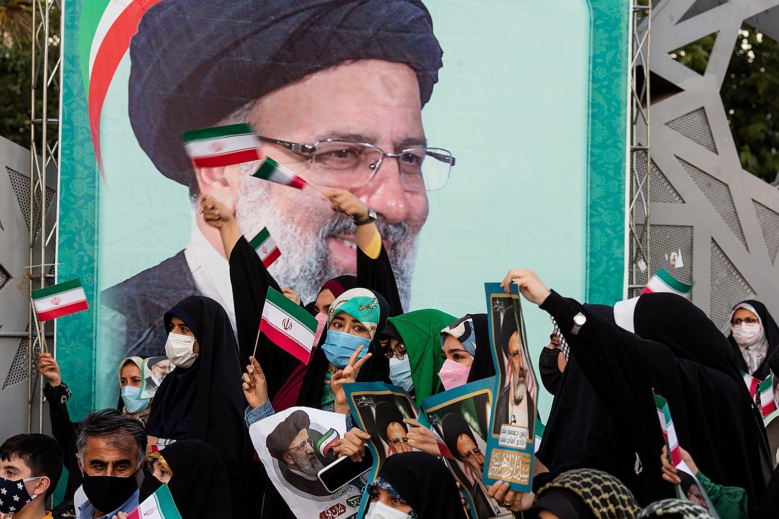 Supporters of Iran's President-elect Ebrahim Raisi celebrating in Teheran last Saturday. The UAE, whose commercial hub Dubai is a trade gateway for Iran, and Oman, which often plays a mediation role, were swift to congratulate Mr Raisi. Saudi Arabia