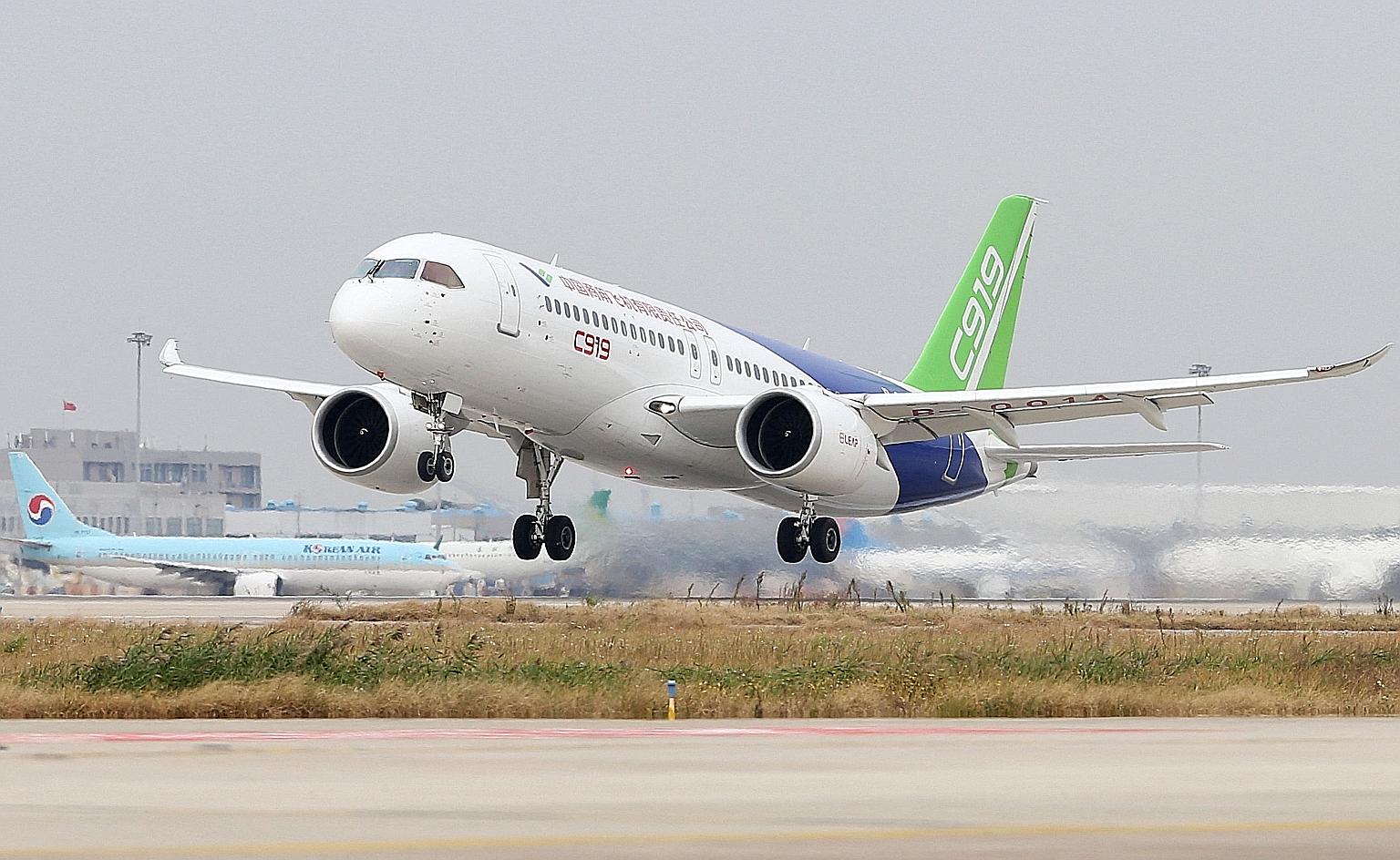 A 2017 photo of the Comac C919, China's first large passenger jet, taking off from Pudong International Airport in Shanghai. It is viewed as a potential rival to Airbus' A320 and Boeing's B737.