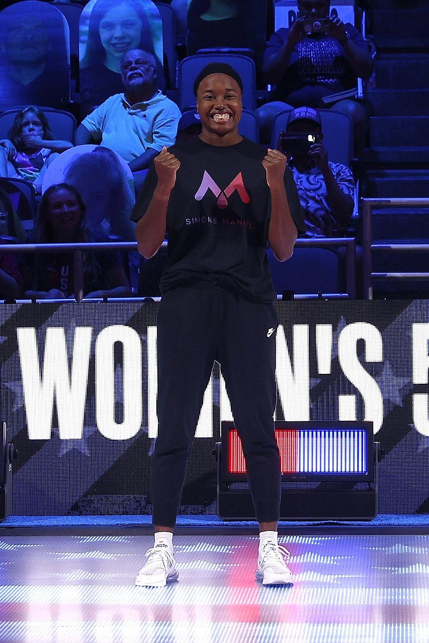 Simone Manuel rejoicing after booking her spot at next month's Olympic Games with her 50m freestyle win at the US Olympic swimming trials on Sunday.