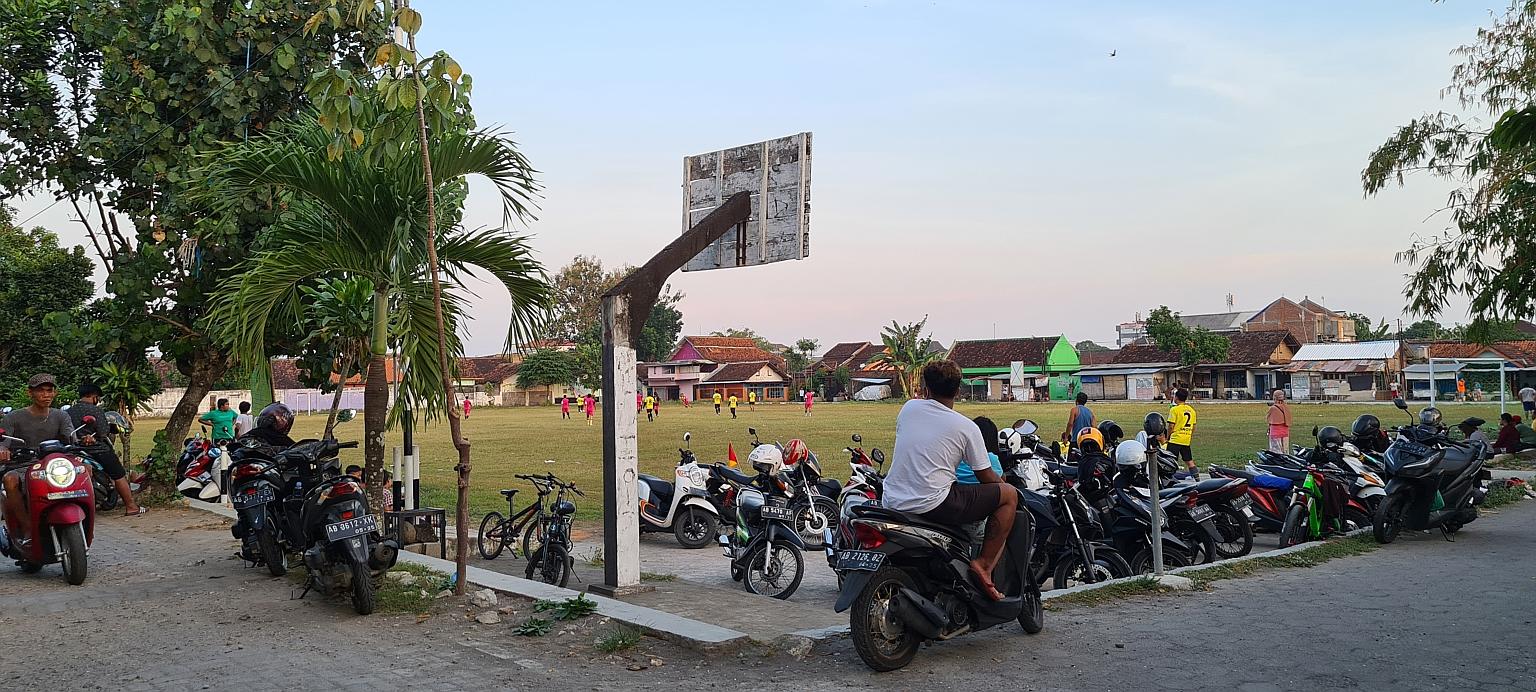 People playing football in a field in Bantul regency, a high-risk Covid-19 red zone, in Yogyakarta province. Daily cases in the province of about 3.7 million have been hovering around 600 or more since Saturday.