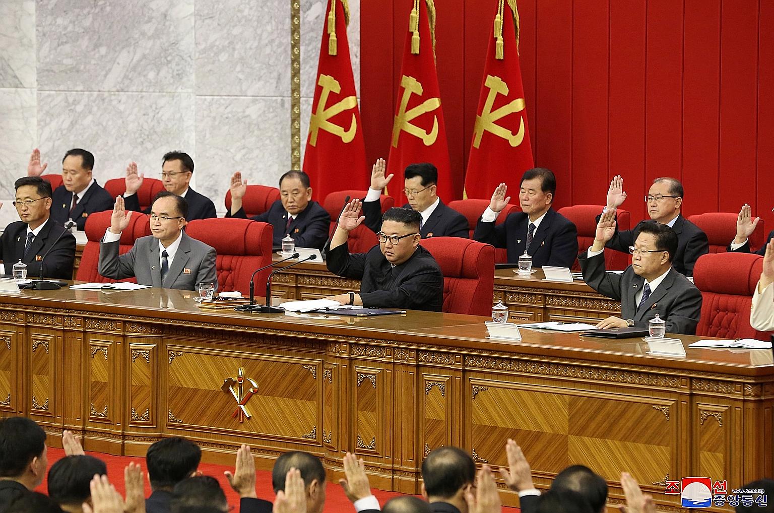 North Korean leader Kim Jong Un (front row, third from left) presiding over the third Plenary Meeting of the 8th Central Committee of the Workers' Party of Korea in Pyongyang, North Korea, last Friday.